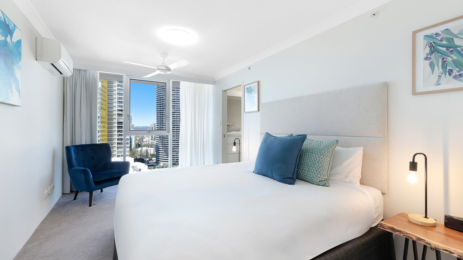 Master bedroom in the Premium 2 Bedroom Ocean View Apartment at ULTIQA Beach Haven with city views and king bed.