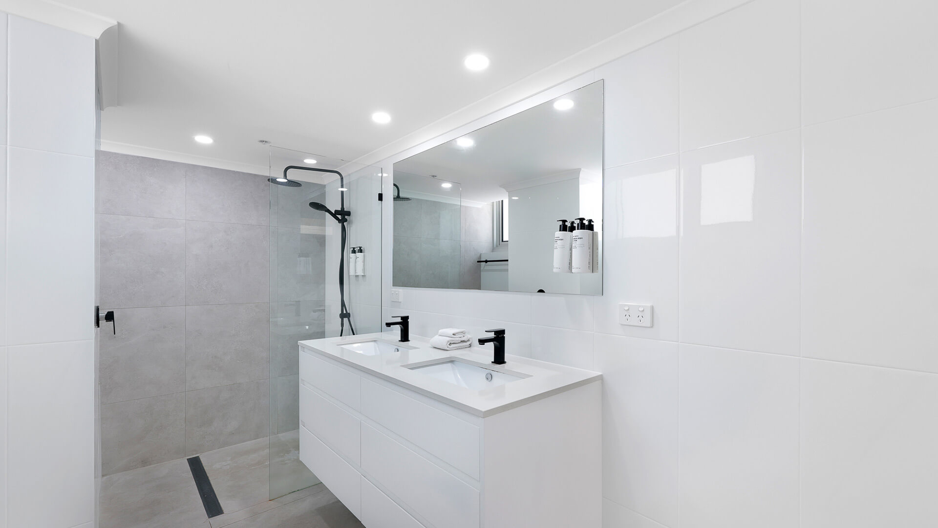 Bathroom in the Premium 2 Bedroom Ocean View Apartment at ULTIQA Beach Haven, featuring a walk-in shower and dual vanity.
