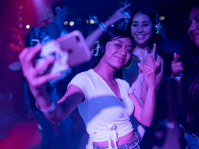 Friends enjoying Gold Coast nightlife at a lively club event.