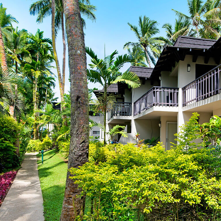 Exterior view of villas at ULTIQA Fiji Palms Beach Resort.