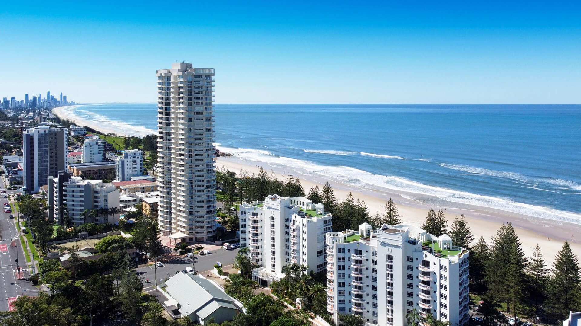 Aerial view of ULTIQA Burleigh Mediterranean Resort, perfectly positioned along the Gold Coast beachfront with sweeping ocean views and easy access to the sand.