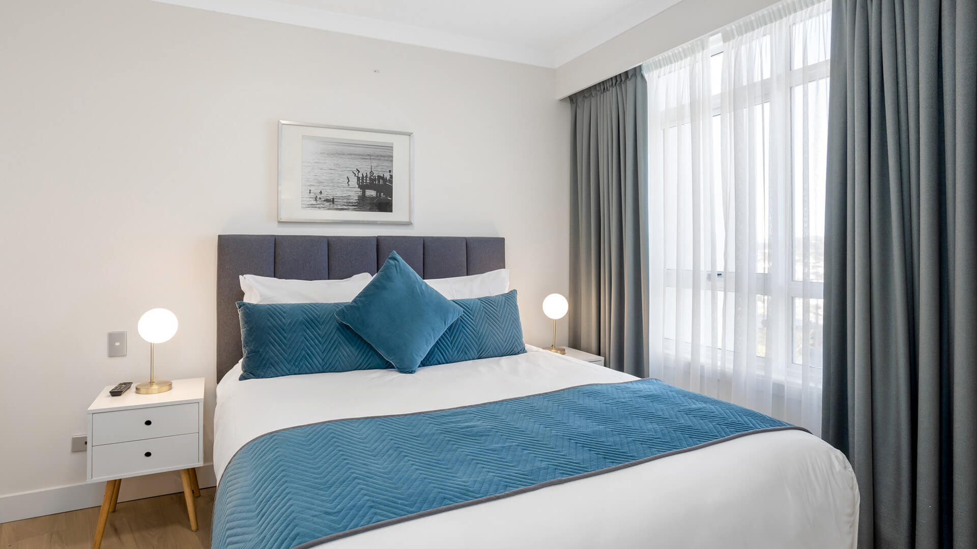 1 Bedroom Apartment at ULTIQA Burleigh Mediterranean Resort with queen bed and natural light.