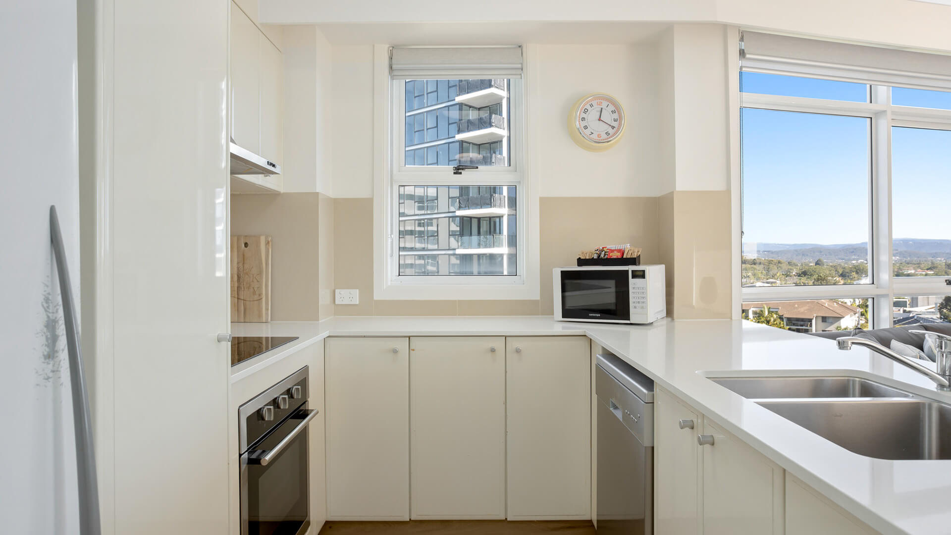 Full kitchen with oven, microwave, and scenic views.