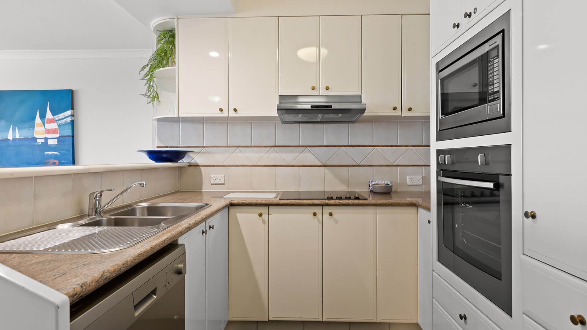 Fully equipped kitchen in 2 Bedroom Apartment at ULTIQA Burleigh Mediterranean Resort.