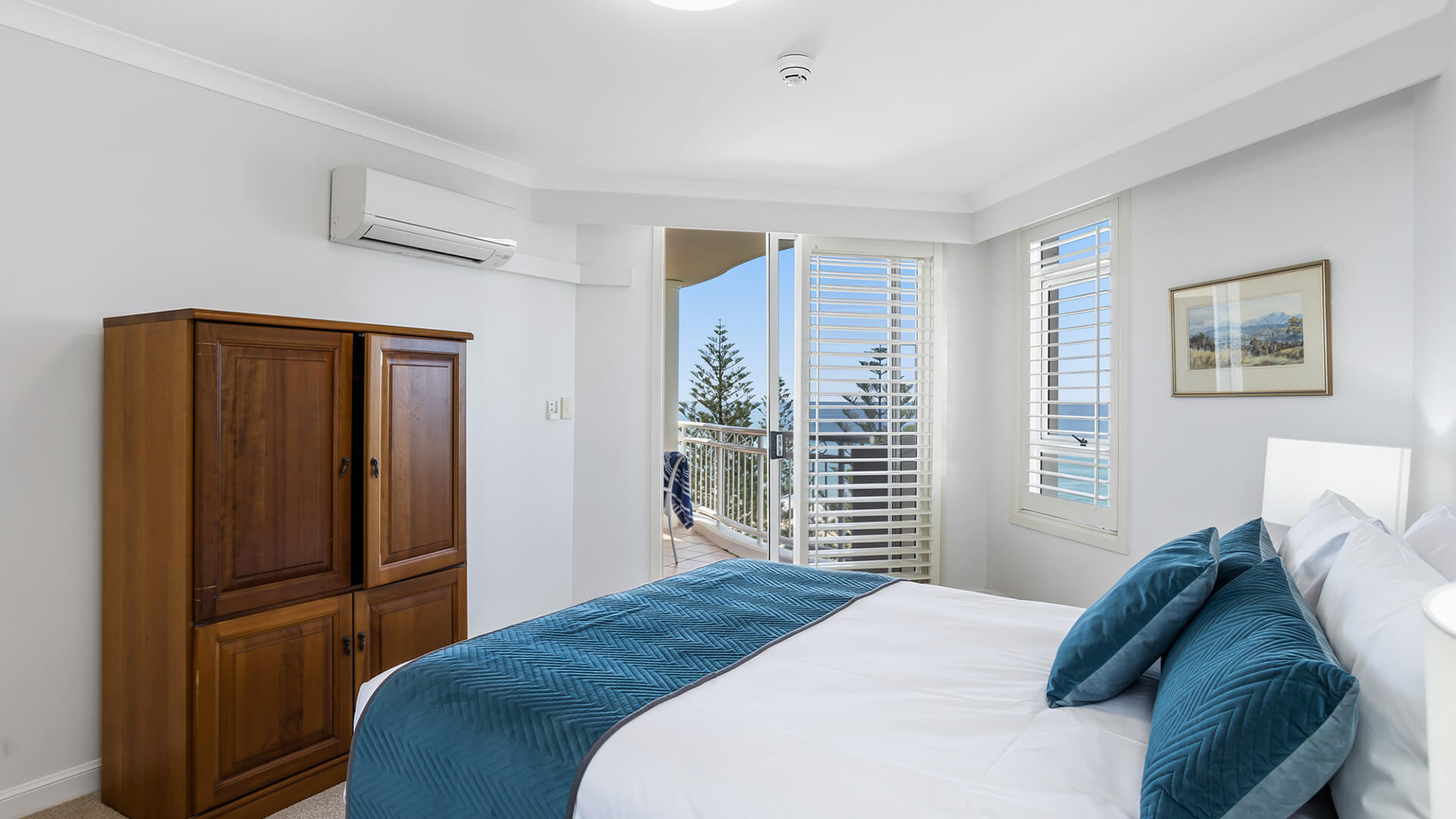 Bedroom with ocean-view balcony in 2 Bedroom Apartment at ULTIQA Burleigh Mediterranean Resort.