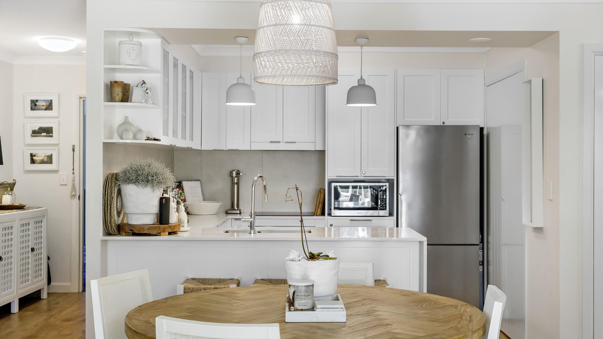 Modern kitchen and dining area in 2 Bedroom Superior Apartment at ULTIQA Burleigh Mediterranean Resort.