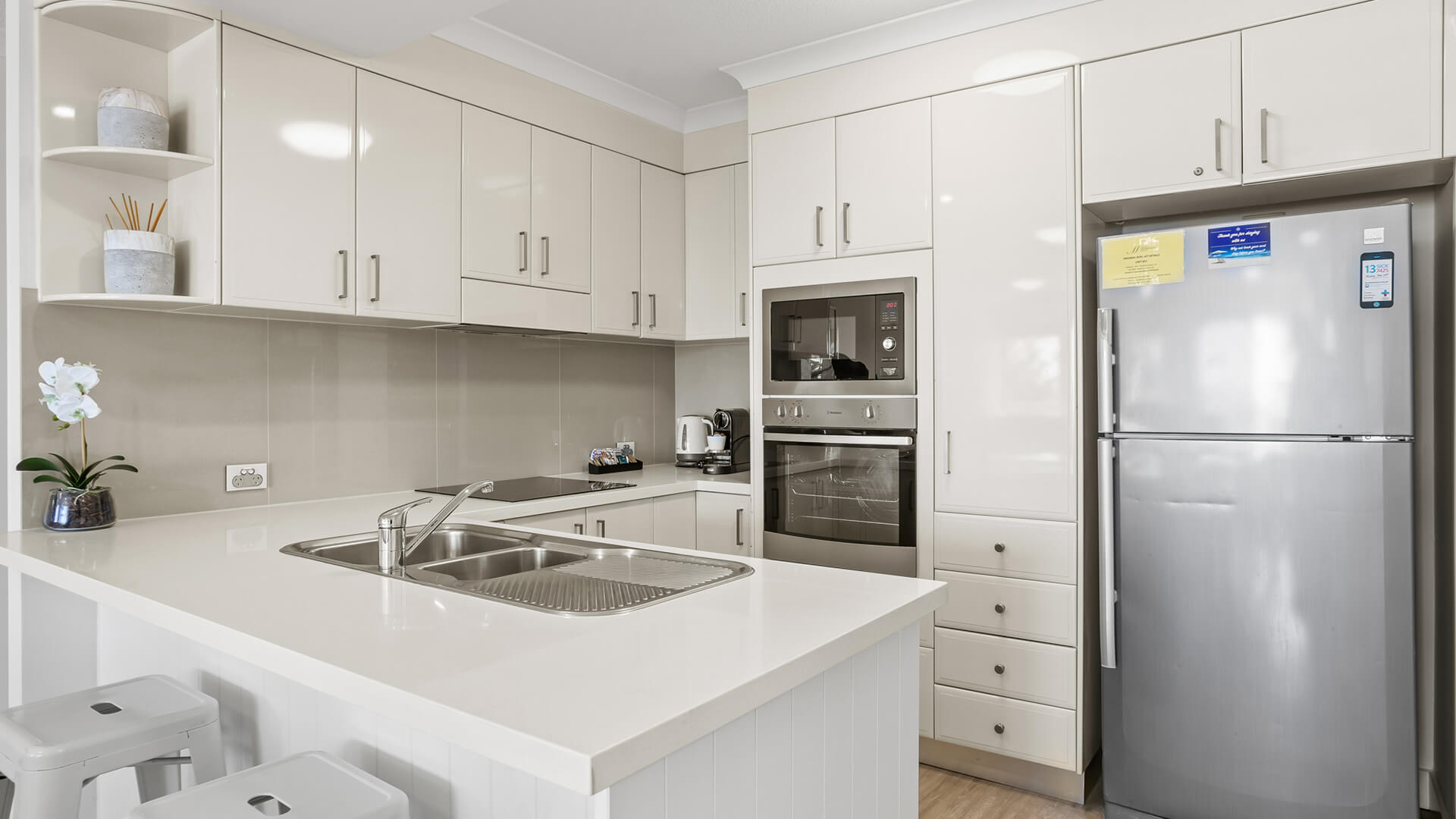Fully equipped kitchen in 2 Bedroom Superior Ocean View Apartment at ULTIQA Burleigh Mediterranean Resort.