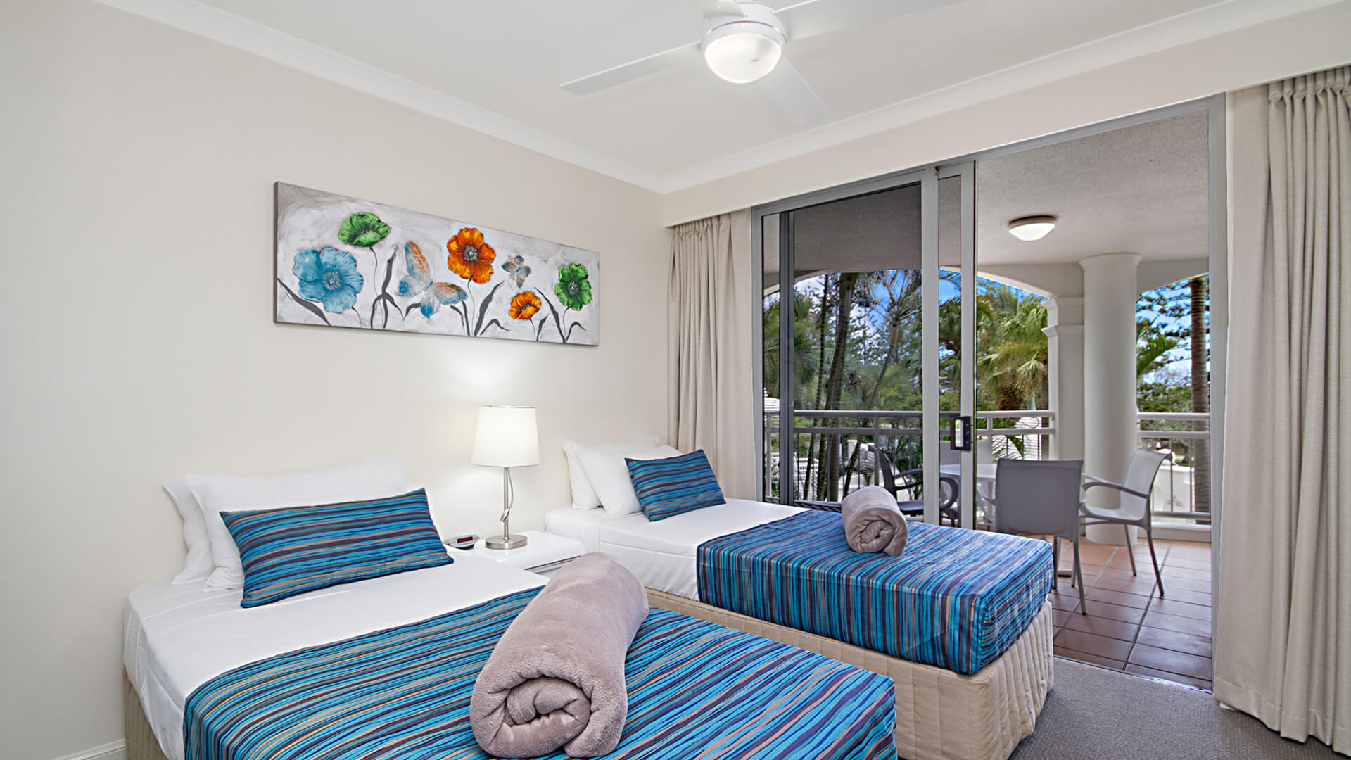 Twin bedroom with balcony access in 3 Bedroom Apartment at ULTIQA Burleigh Mediterranean Resort.