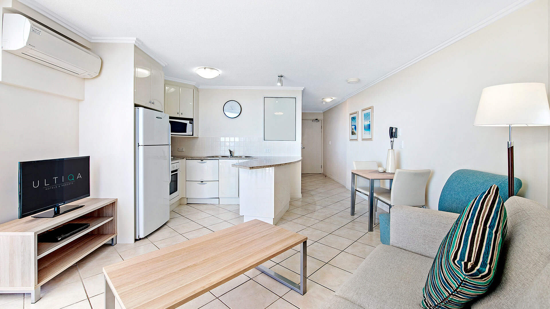 Open-plan kitchen, dining, and lounge area in 1 Bedroom Apartment at ULTIQA Shearwater Resort.