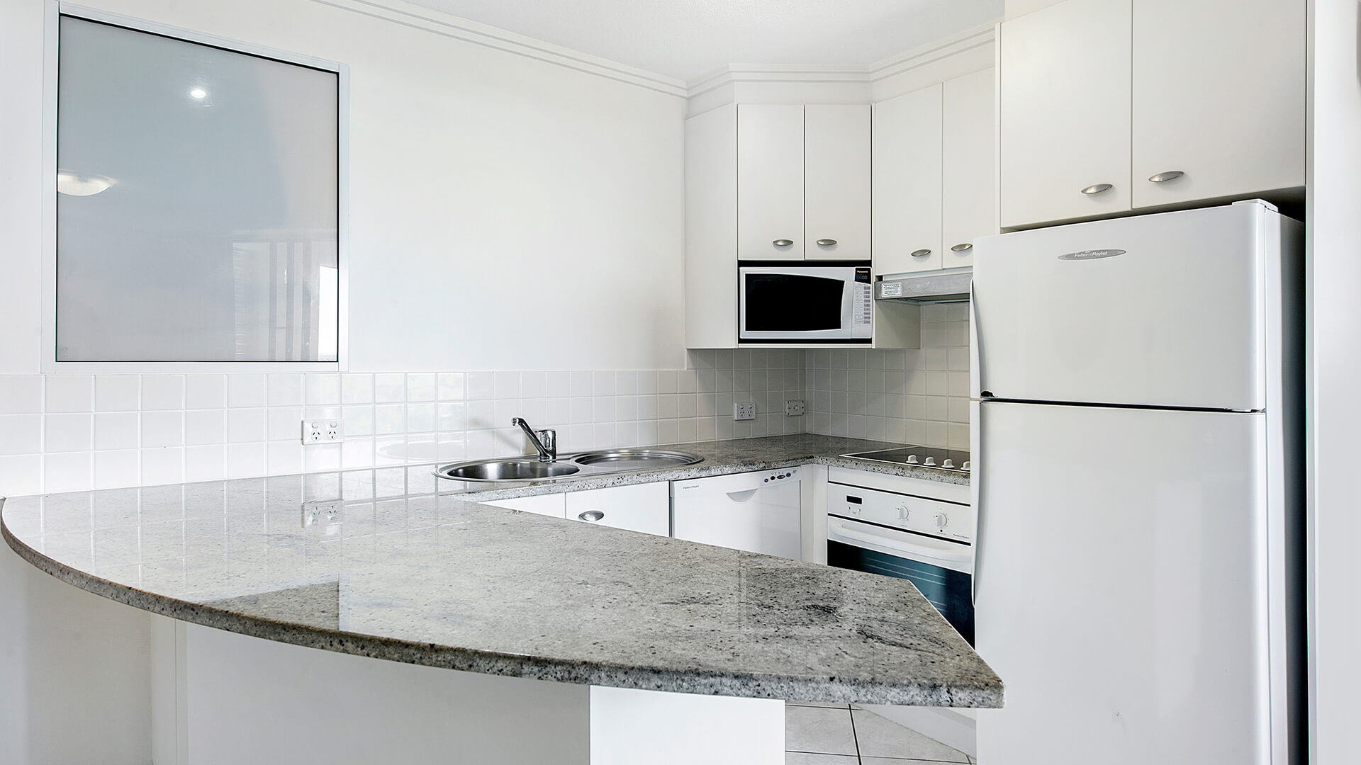 Fully equipped kitchen in 1 Bedroom Apartment at ULTIQA Shearwater Resort.
