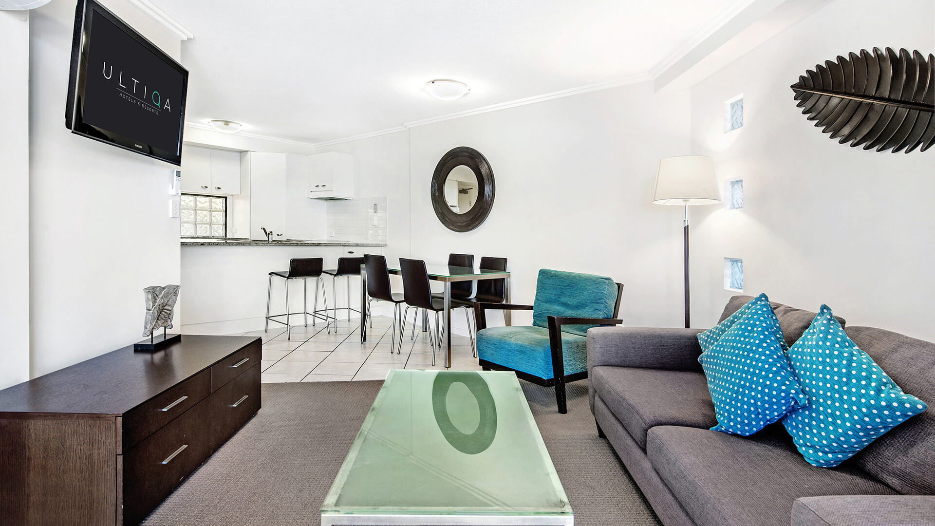 Open-plan living and dining area in 2 Bedroom Apartment at ULTIQA Shearwater Resort.
