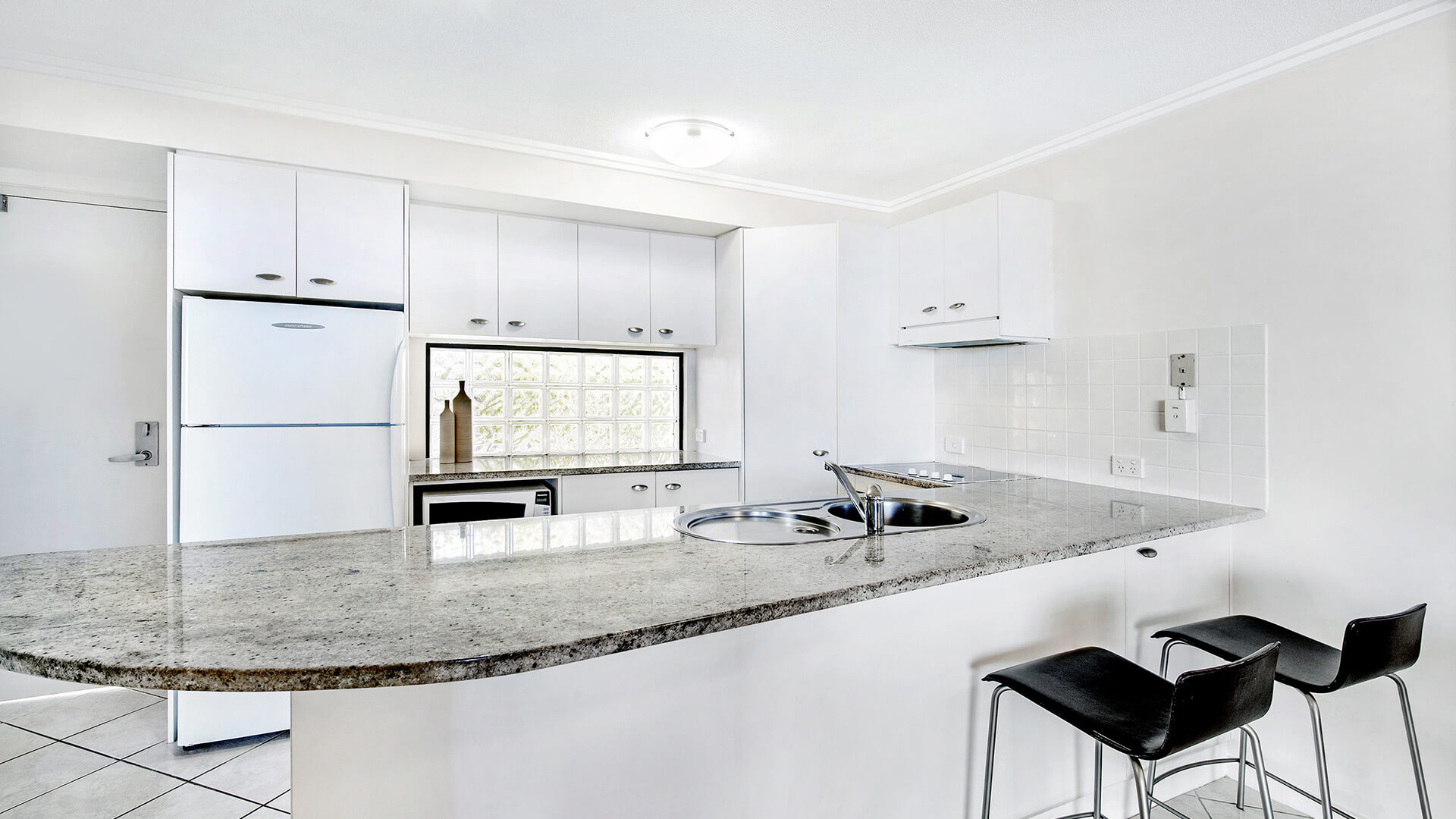 Full kitchen with breakfast bar in 2 Bedroom Apartment at ULTIQA Shearwater Resort.