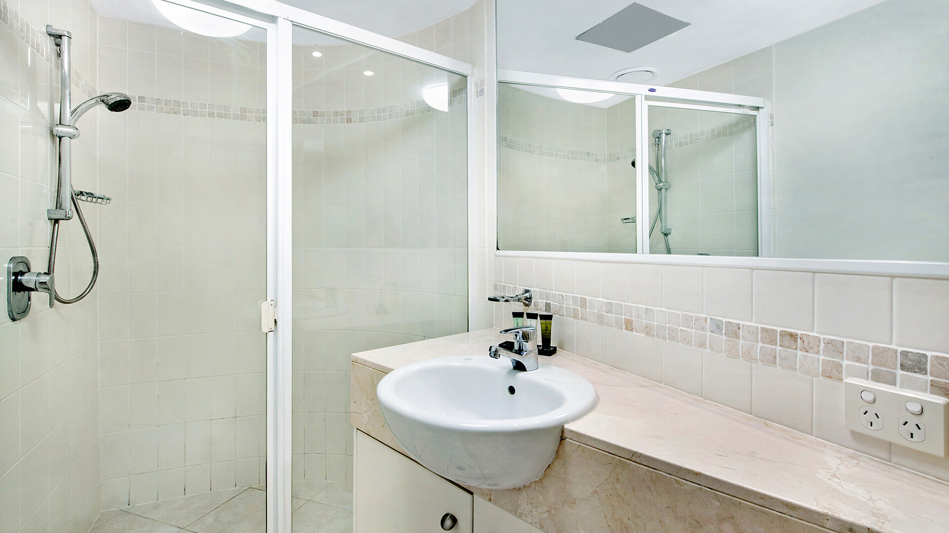 Bathroom with walk-in shower in 2 Bedroom Apartment at ULTIQA Shearwater Resort.