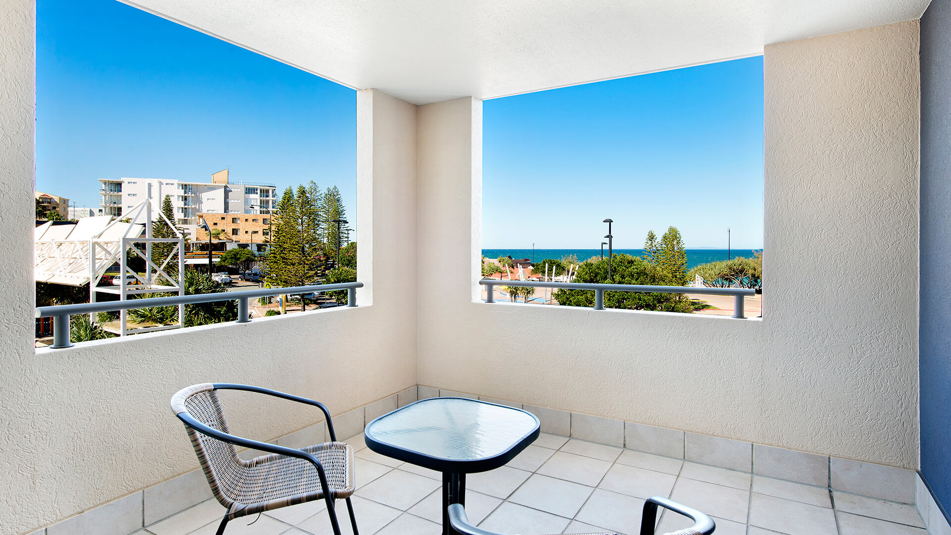 Private balcony with seating and ocean views in 2 Bedroom Apartment at ULTIQA Shearwater Resort.