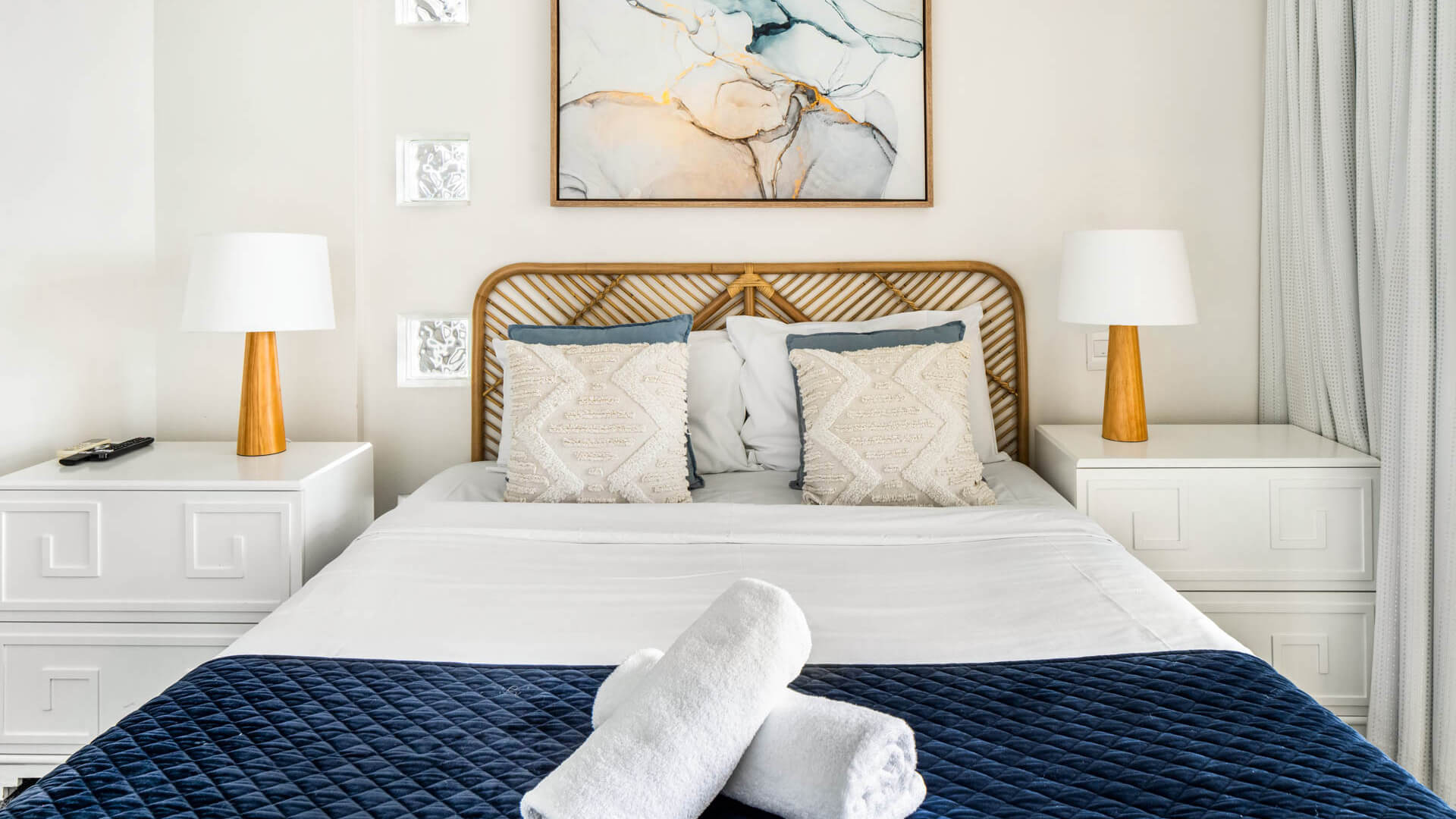 Bedroom with queen bed and modern coastal décor in 3 Bedroom Penthouse at ULTIQA Shearwater Resort.