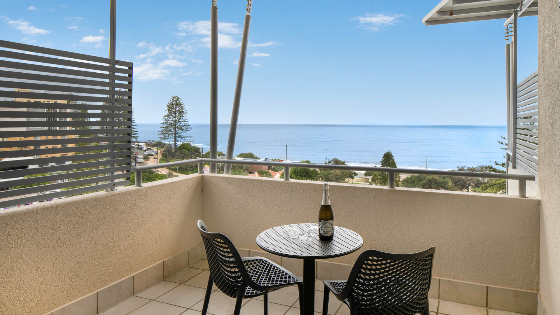 Private balcony with seating and ocean views in 3 Bedroom Penthouse at ULTIQA Shearwater Resort.