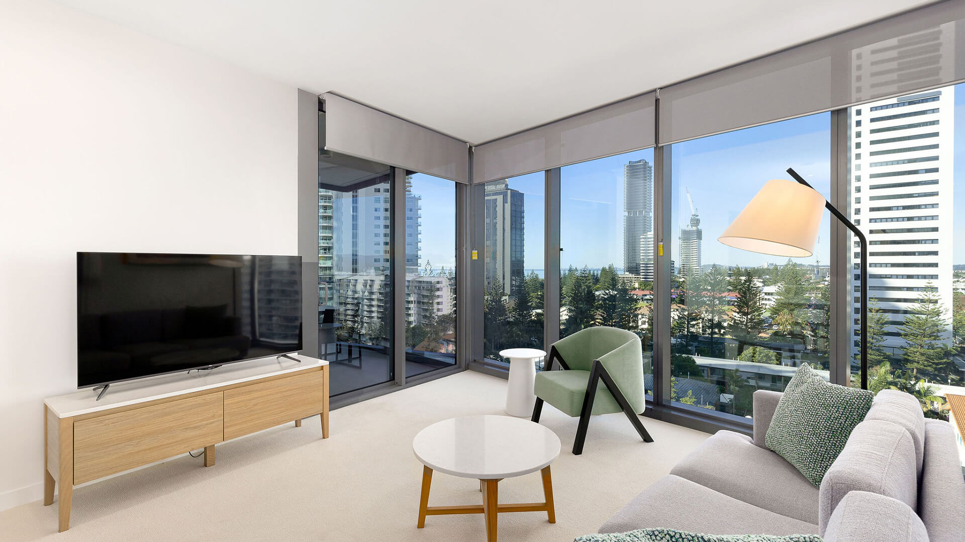 Living area with city views in the 1 Bedroom Suite at ULTIQA Signature at Broadbeach.