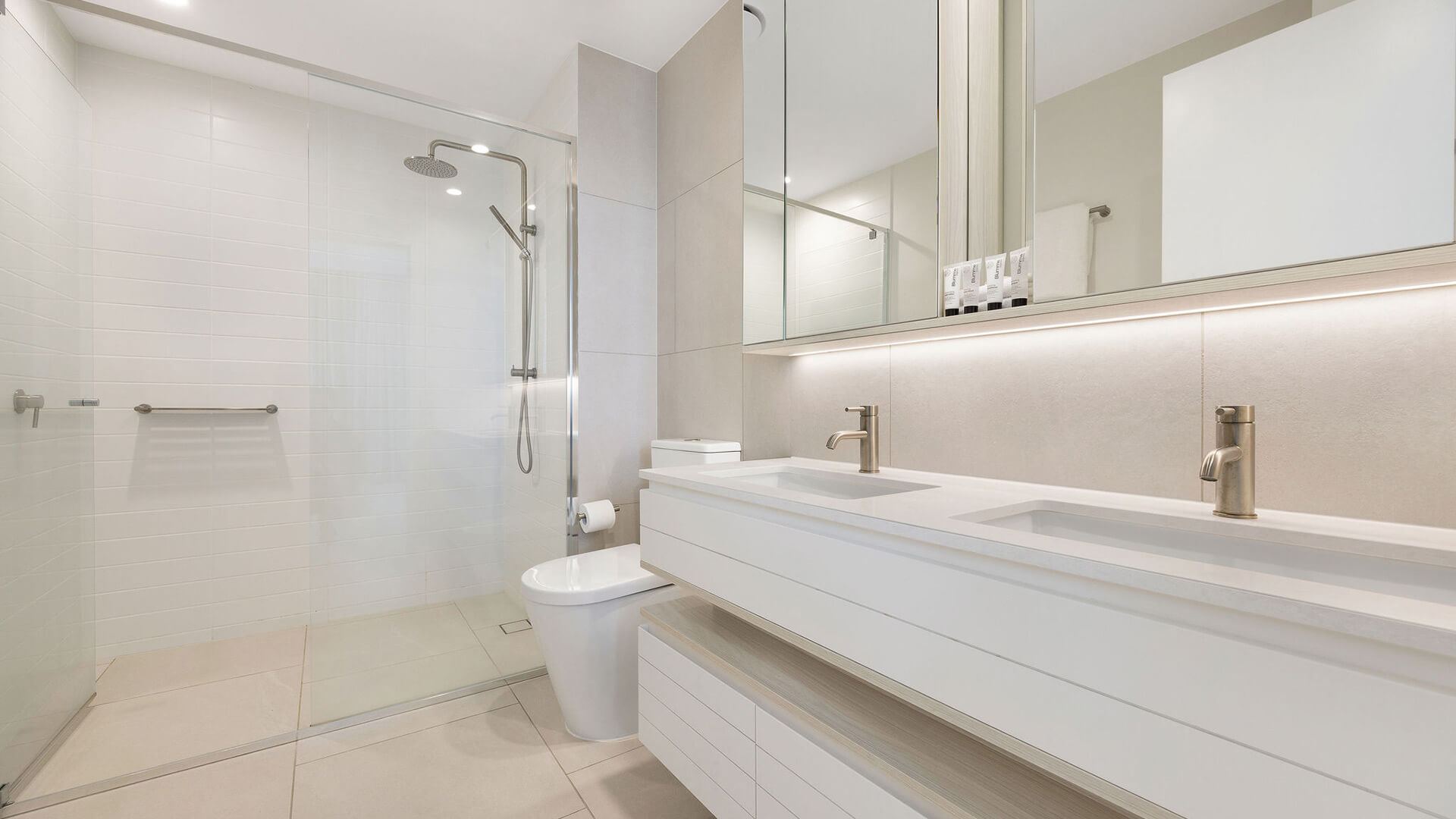 Modern bathroom with dual vanity, walk-in shower, and contemporary finishes in the 2 Bedroom Skyhome at ULTIQA Signature at Broadbeach.