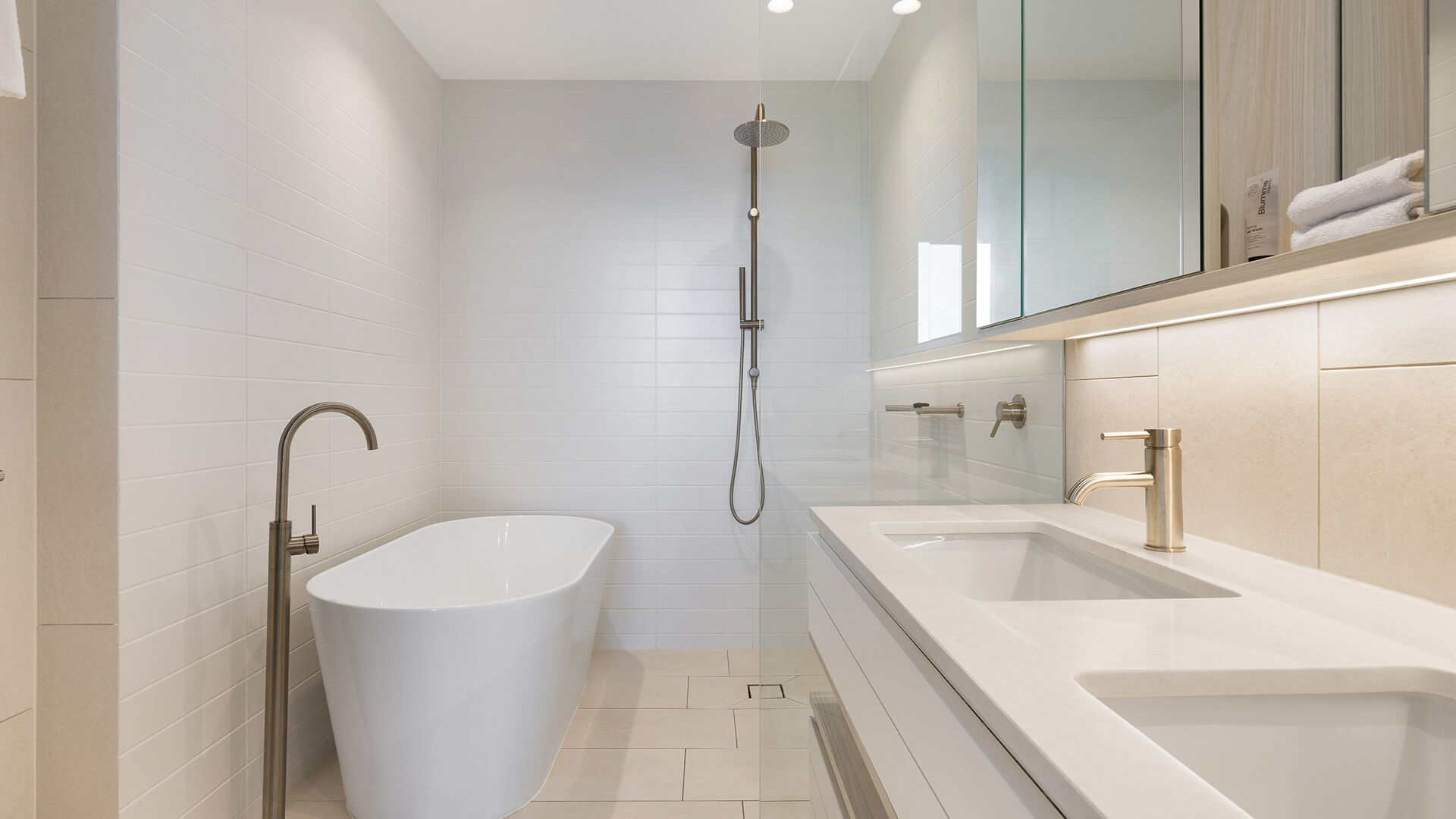 Modern bathroom with freestanding bathtub and double vanity in the 2 Bedroom Ocean View Suite Premium at ULTIQA Signature at Broadbeach.