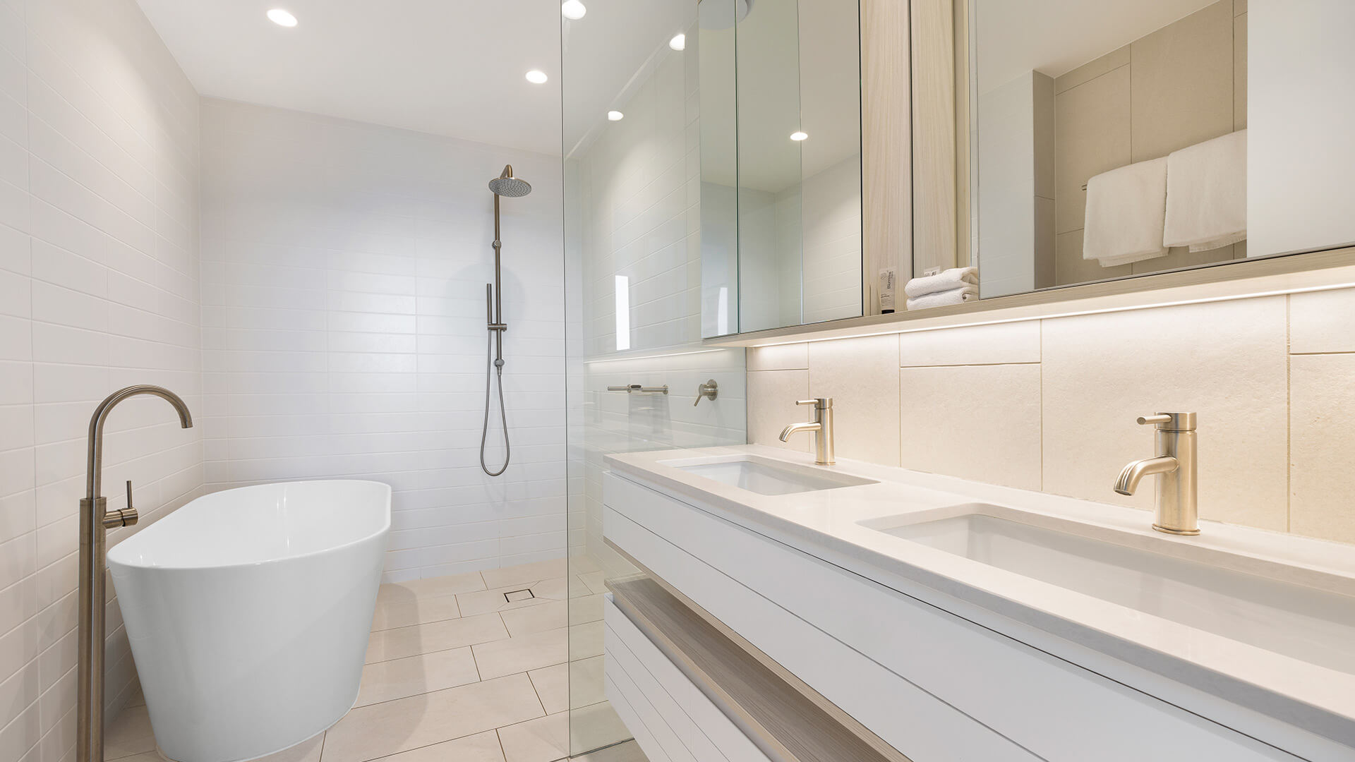 Elegant bathroom with freestanding bathtub, rain shower, and double vanity in the 2 Bedroom Ocean View Suite Premium at ULTIQA Signature at Broadbeach.