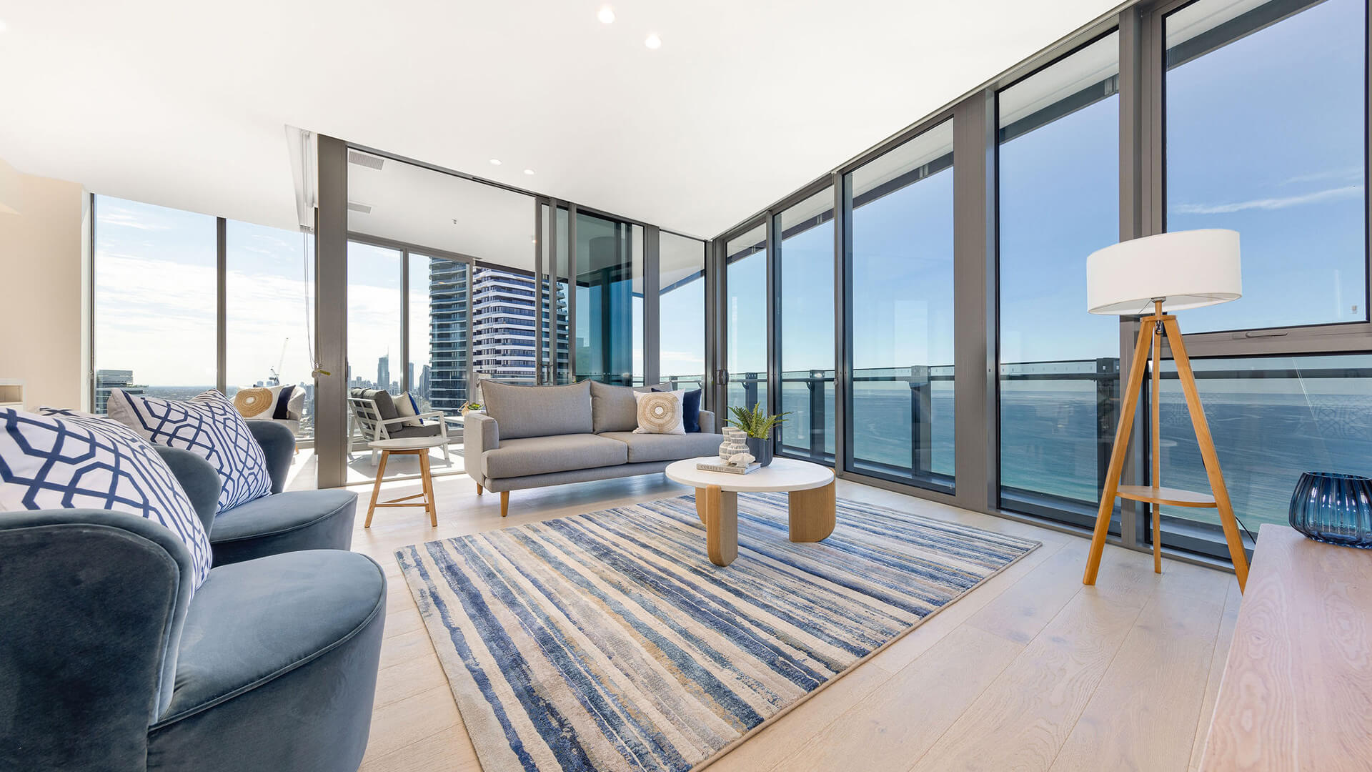 Living room in 3 Bedroom Ocean Sub-Penthouse at ULTIQA Signature at Broadbeach with panoramic ocean views.