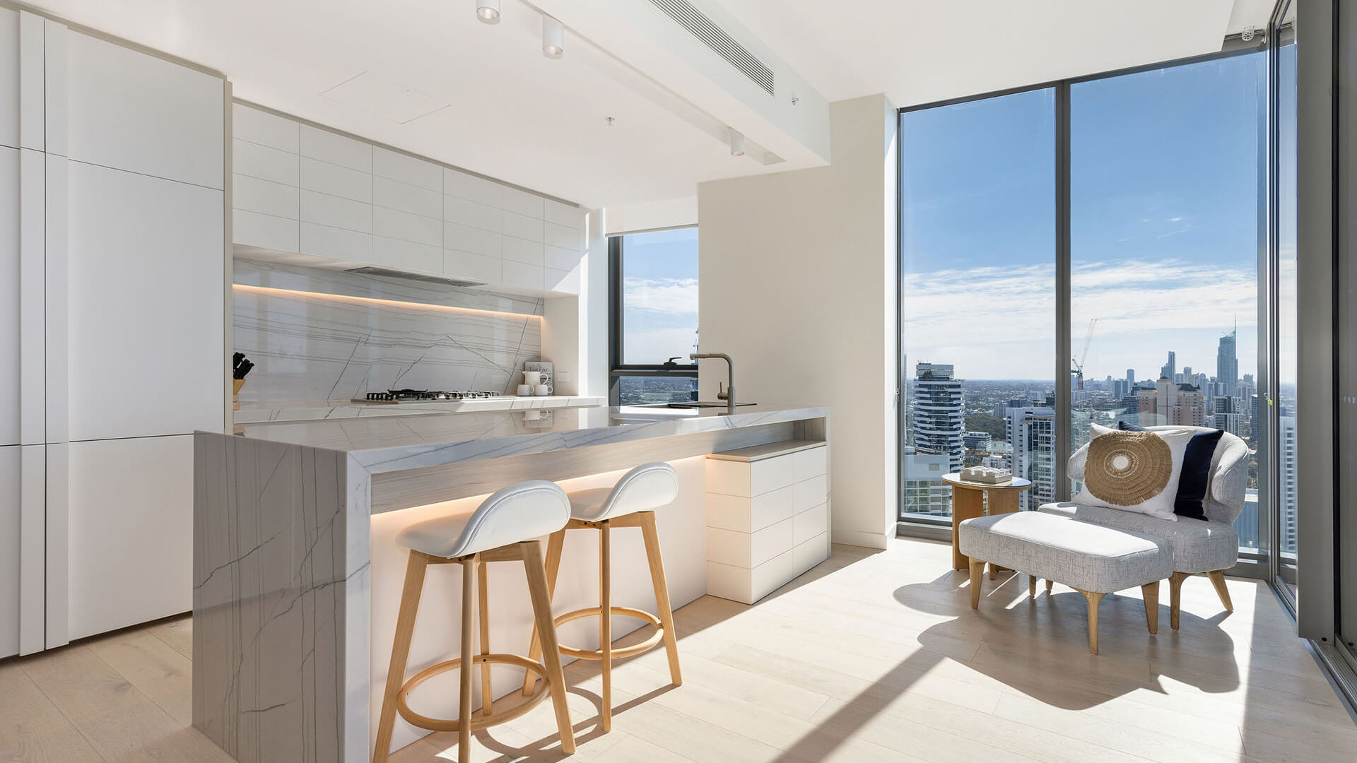 Kitchen in 3 Bedroom Ocean Sub-Penthouse at ULTIQA Signature at Broadbeach with marble island and city views.