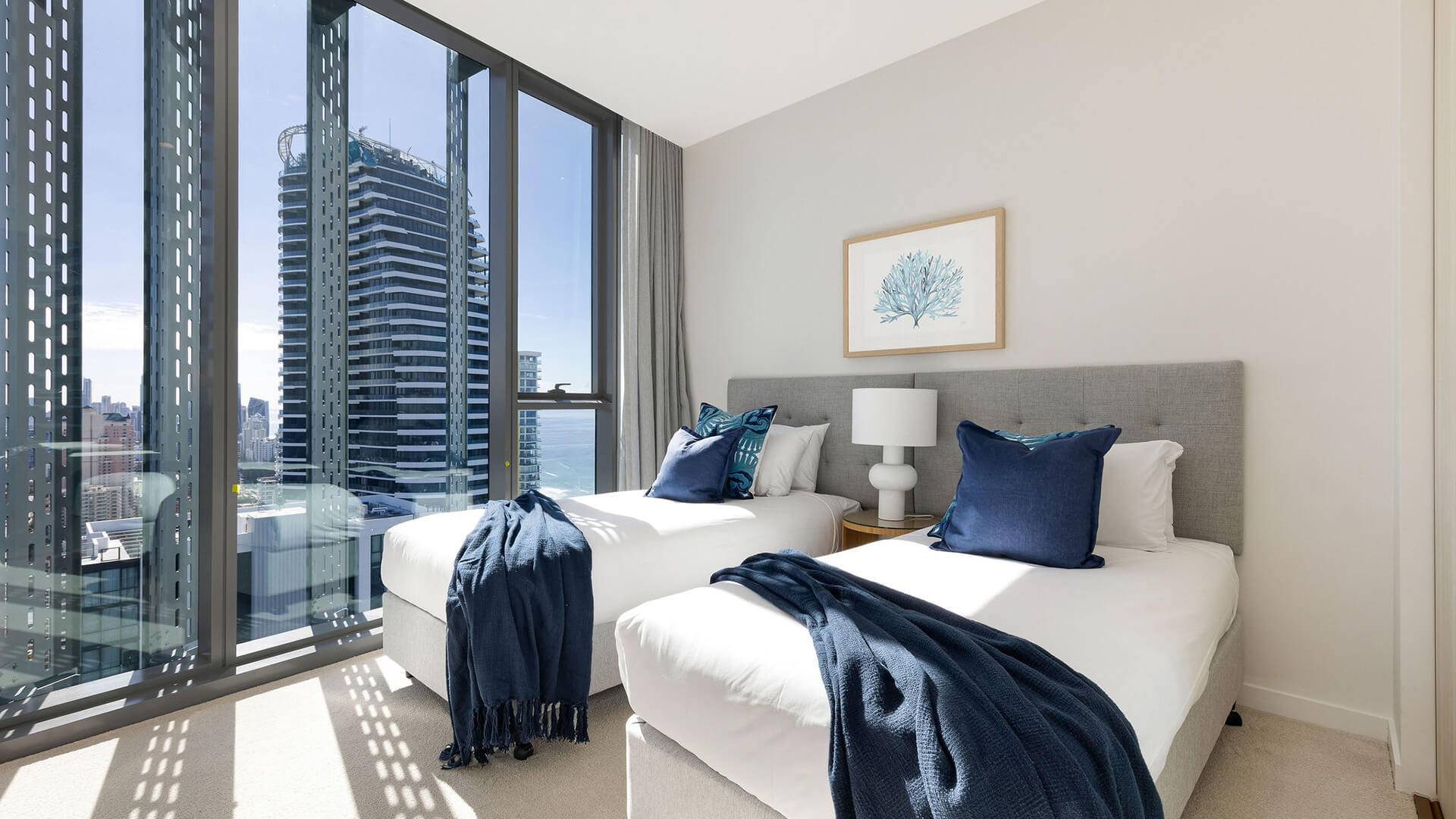 Twin bedroom in 3 Bedroom Ocean Sub-Penthouse at ULTIQA Signature at Broadbeach with city views.