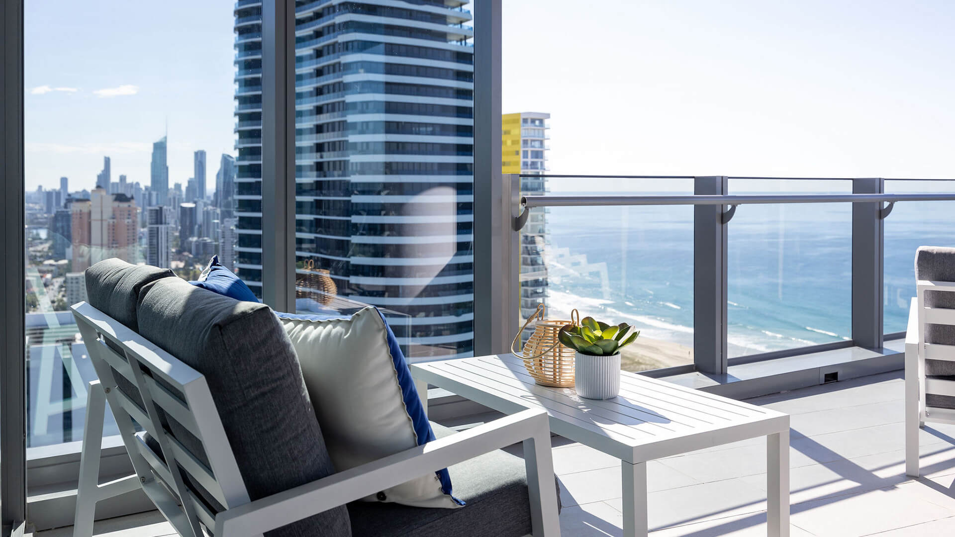 Balcony in 3 Bedroom Ocean Sub-Penthouse at ULTIQA Signature at Broadbeach with city and beach views.