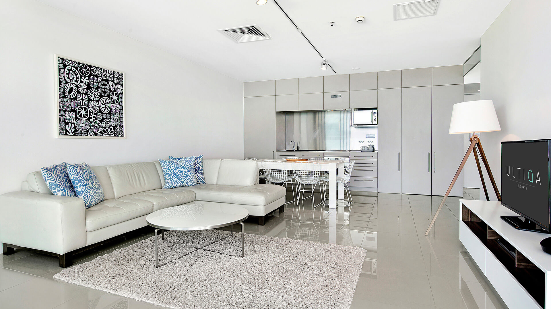 Stylish open-plan lounge and kitchen in 1 Bedroom Ocean View Apartment at ULTIQA Air on Broadbeach.