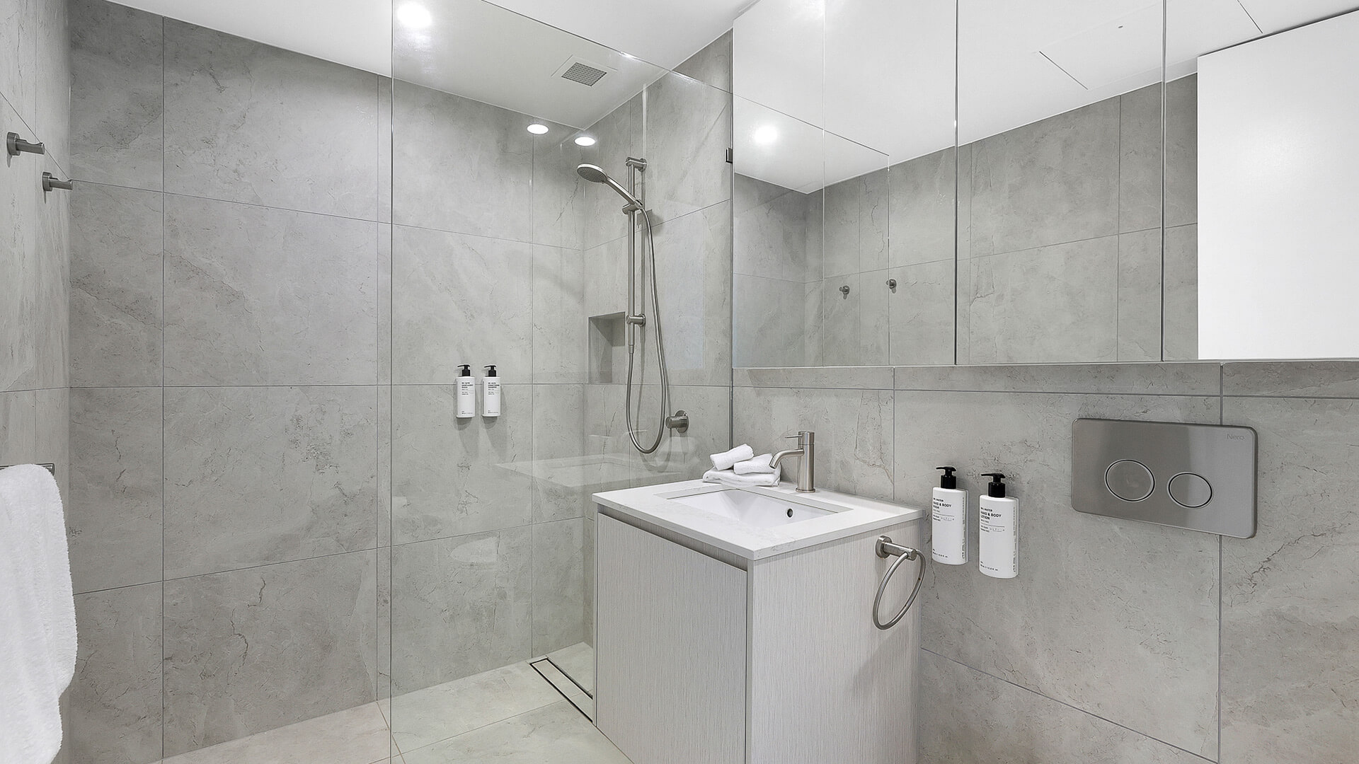 Modern bathroom with walk-in shower in 2 Bedroom Gold Coast View Suite at ULTIQA Air on Broadbeach.