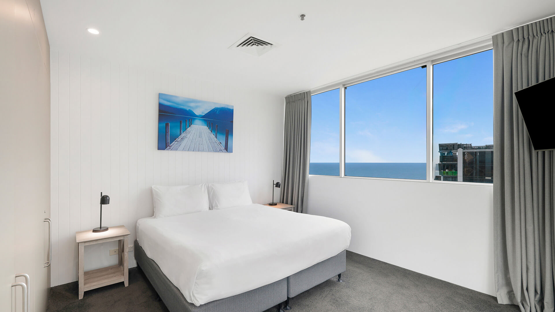 Master bedroom with king bed and ocean views in 2 Bedroom Gold Coast View Suite at ULTIQA Air on Broadbeach.