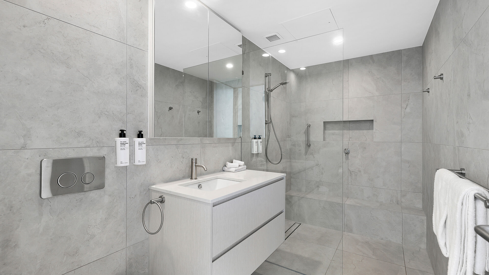 Modern bathroom with walk-in shower in 2 Bedroom Gold Coast View Suite at ULTIQA Air on Broadbeach.