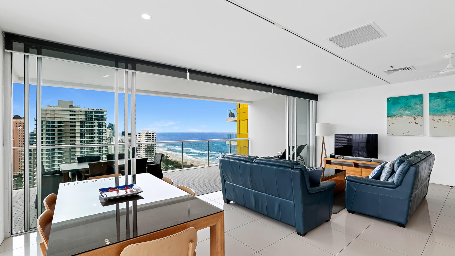 Open-plan living and dining with ocean views in 2 Bedroom Gold Coast View Suite at ULTIQA Air on Broadbeach.