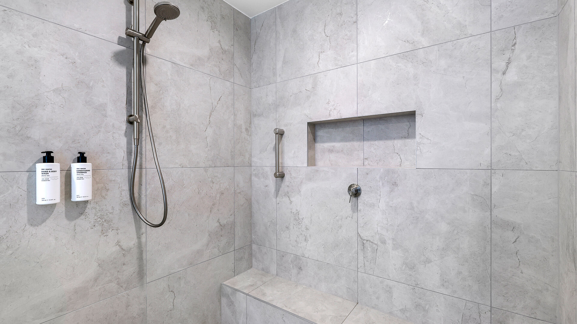 Bathroom with walk-in shower with modern fittings in 2 Bedroom Gold Coast View Suite at ULTIQA Air on Broadbeach.