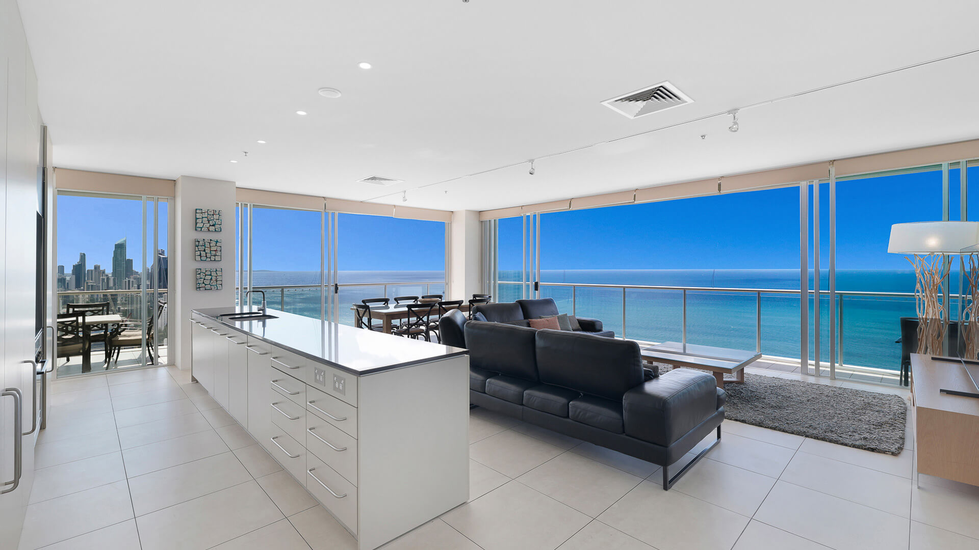 Open plan kitchen and living area with ocean views in 4 Bedroom Ocean View Apartment at ULTIQA Air on Broadbeach.