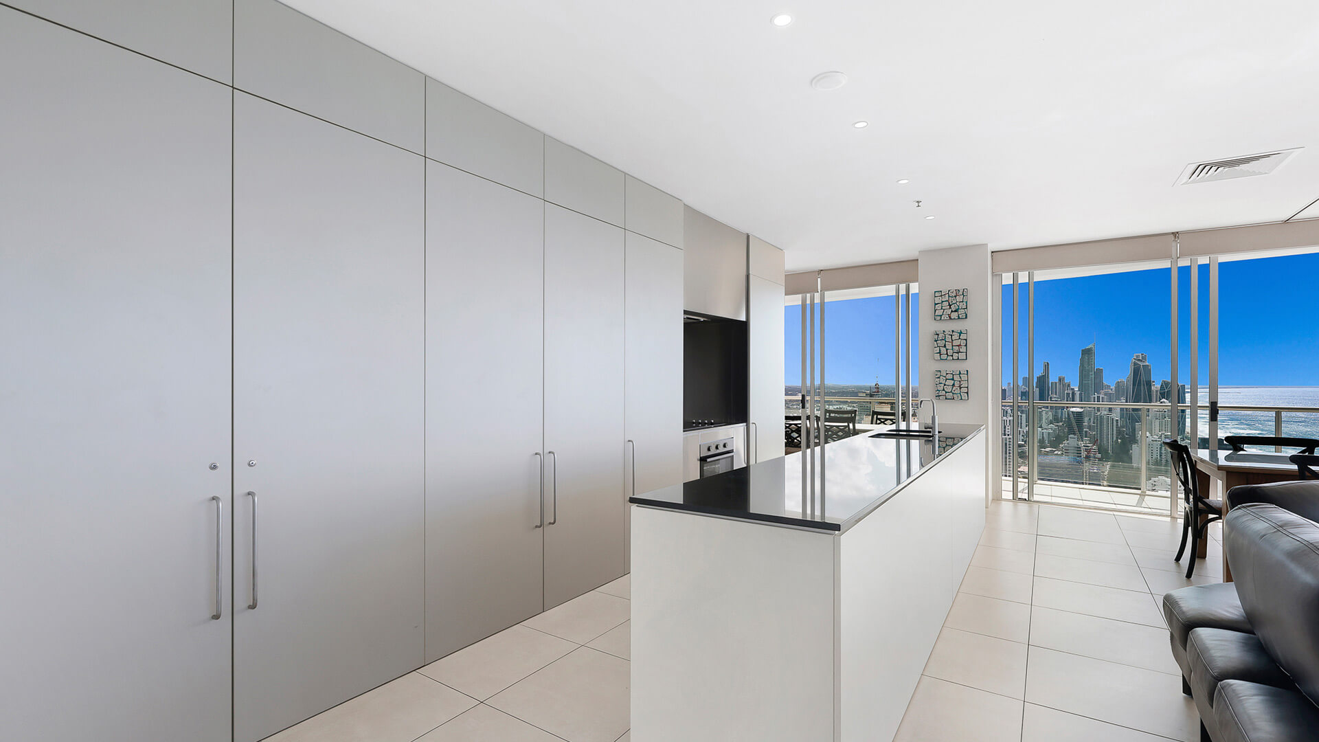 Modern kitchen with city and ocean views in 4 Bedroom Ocean View Apartment at ULTIQA Air on Broadbeach.