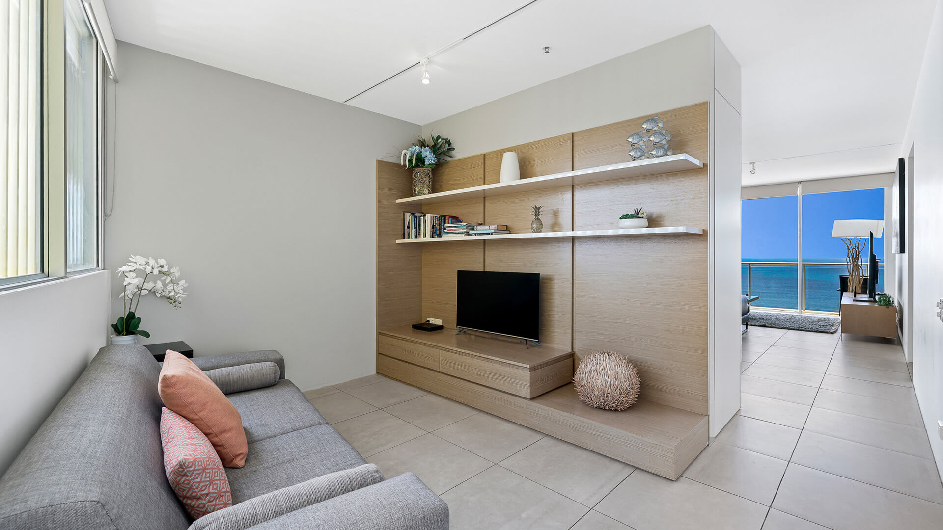 Separate media area with sofa and TV in 4 Bedroom Ocean View Apartment at ULTIQA Air on Broadbeach.