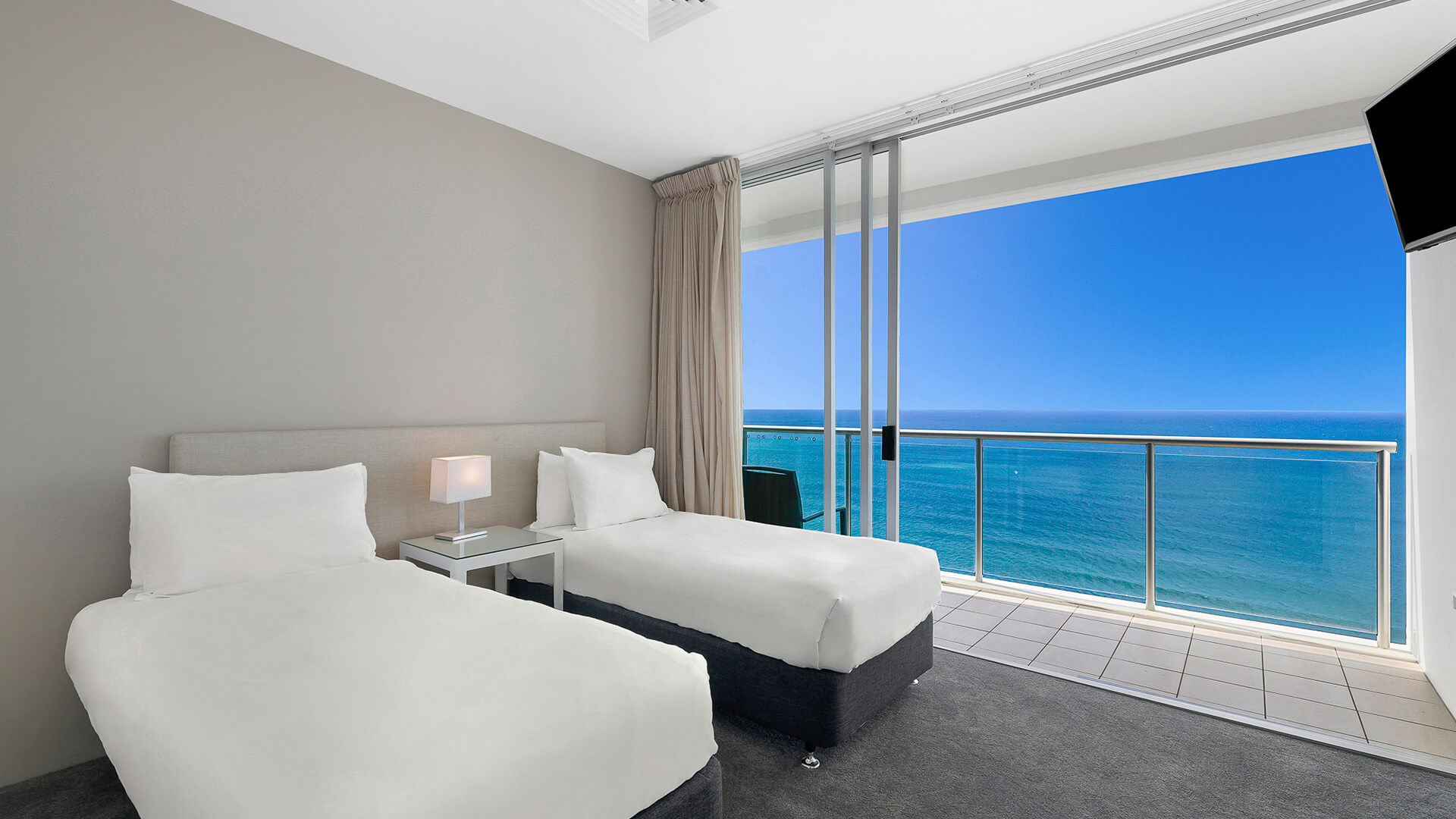Bedroom with twin beds and ocean views in 4 Bedroom Ocean View Apartment at ULTIQA Air on Broadbeach.