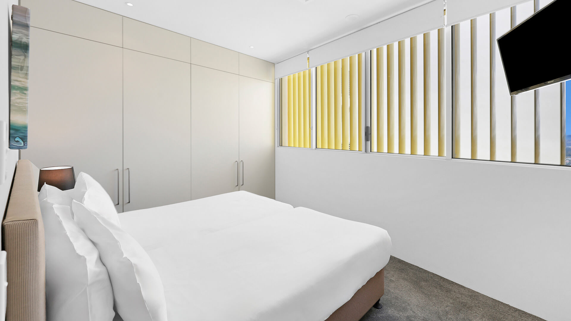 Guest bedroom with double bed and built in wardrobes in 4 Bedroom Ocean View Apartment at ULTIQA Air on Broadbeach.