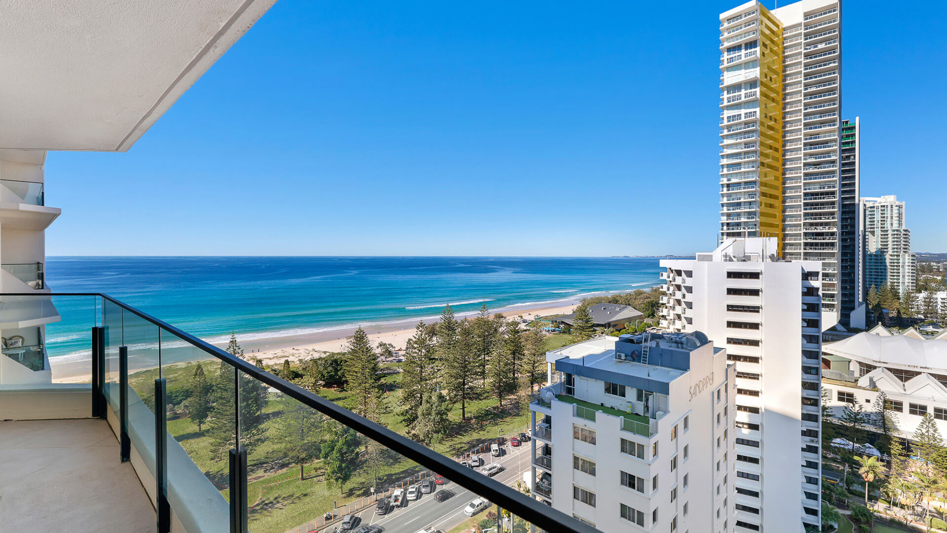 High-floor balcony view from ULTIQA Beach Haven overlooking Broadbeach coastline, parklands, and the Pacific Ocean.