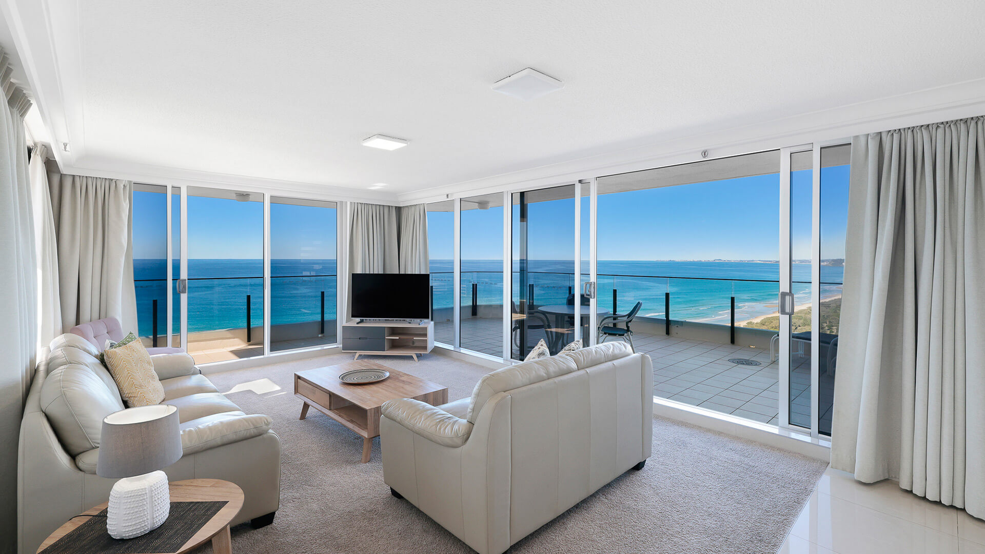 Lounge area with stunning beach views in the Sub Penthouse at ULTIQA Beach Haven.