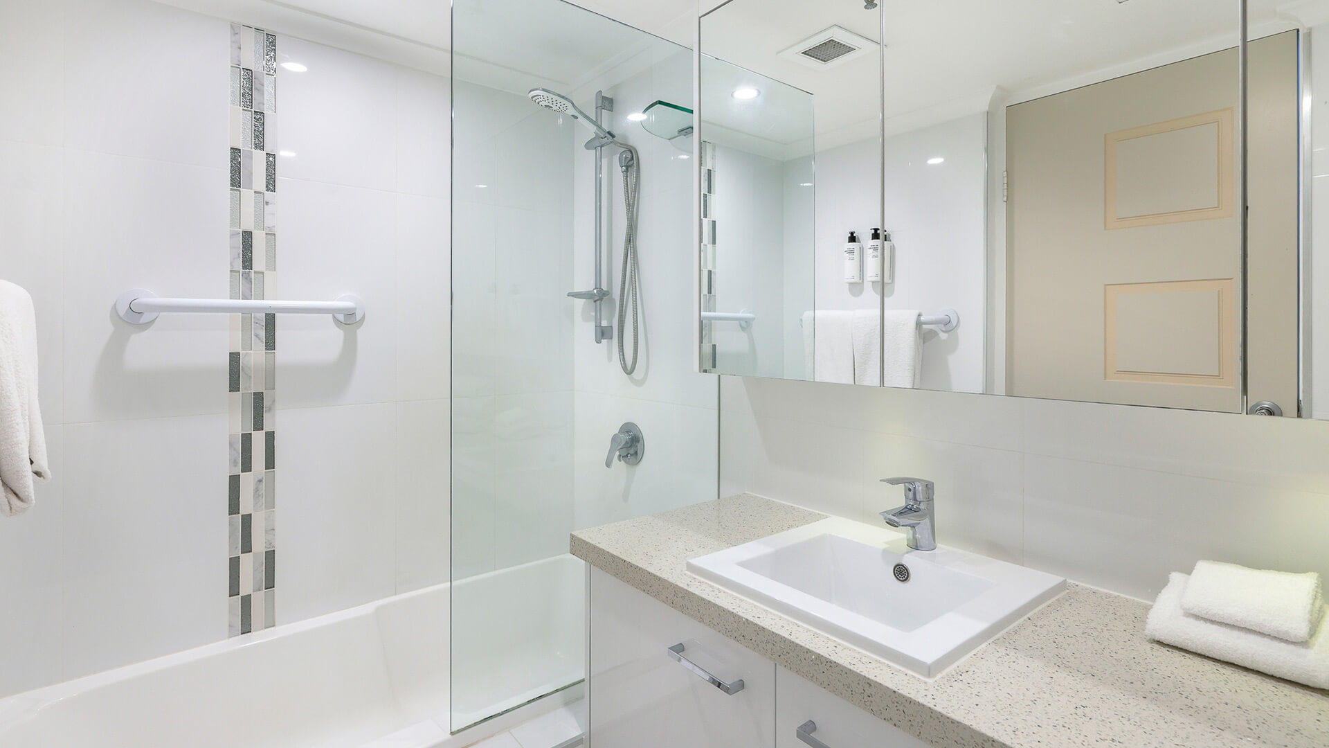Modern bathroom in the Sub Penthouse at ULTIQA Beach Haven, featuring a combined shower and bath.