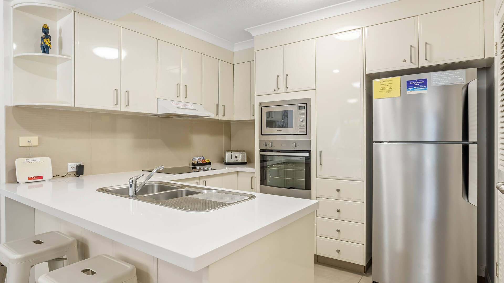 Fully equipped kitchen in 2 Bedroom Garden View Apartment at ULTIQA Burleigh Mediterranean Resort.