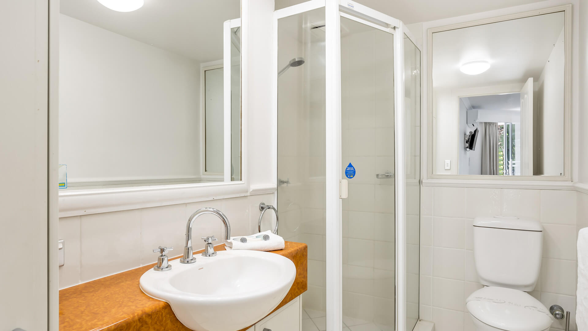 Bathroom with walk-in shower in 2 Bedroom Garden View Apartment at ULTIQA Burleigh Mediterranean Resort.
