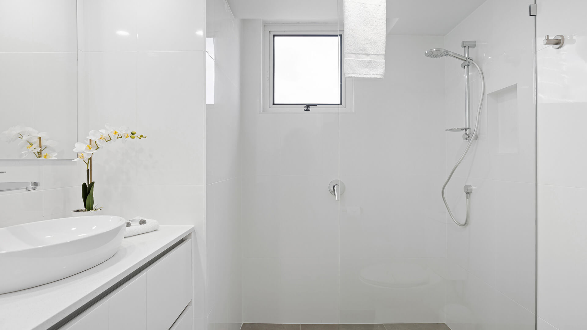 Modern bathroom with walk-in shower and sleek vanity in 3 Bedroom Superior Ocean View Apartment at ULTIQA Burleigh Mediterranean Resort.