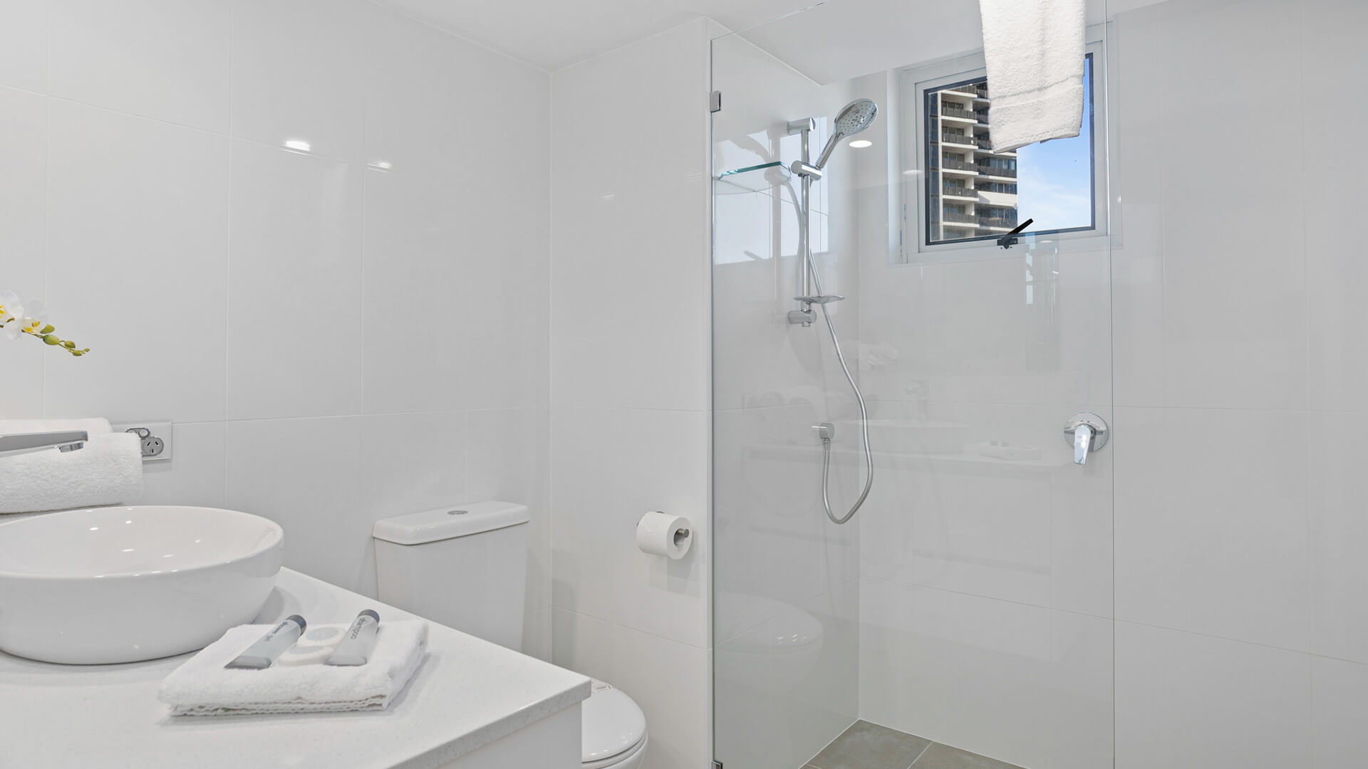 Modern bathroom with walk-in shower in the 3 Bedroom Superior Ocean View Apartment at ULTIQA Burleigh Mediterranean Resort.