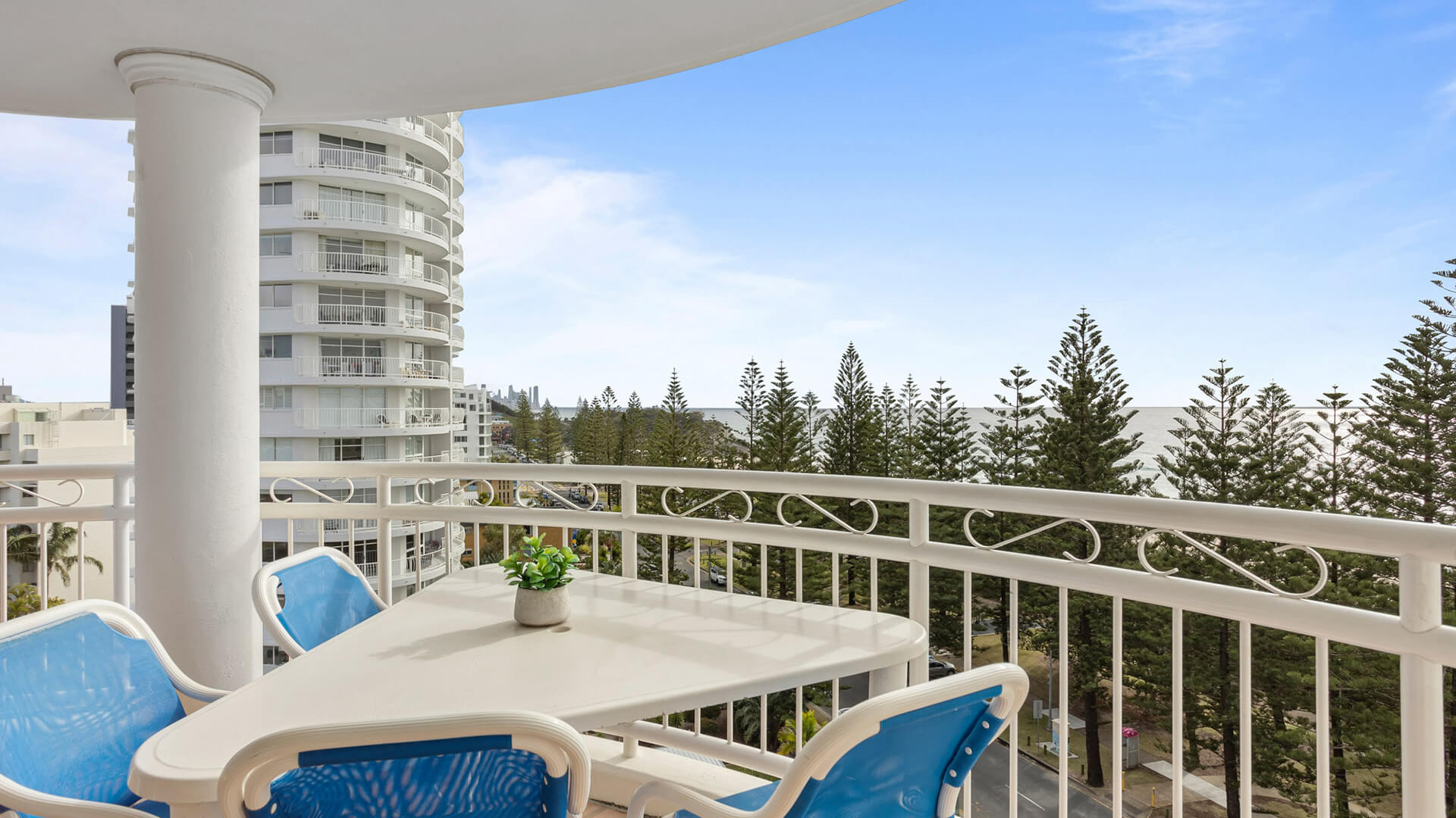Private balcony with partial ocean views in the 3 Bedroom Superior Ocean View Apartment at ULTIQA Burleigh Mediterranean Resort.
