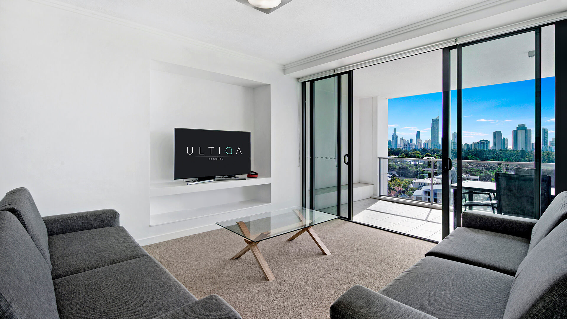 Living area with city skyline views in the 3 Bedroom Apartment at ULTIQA Freshwater Point.
