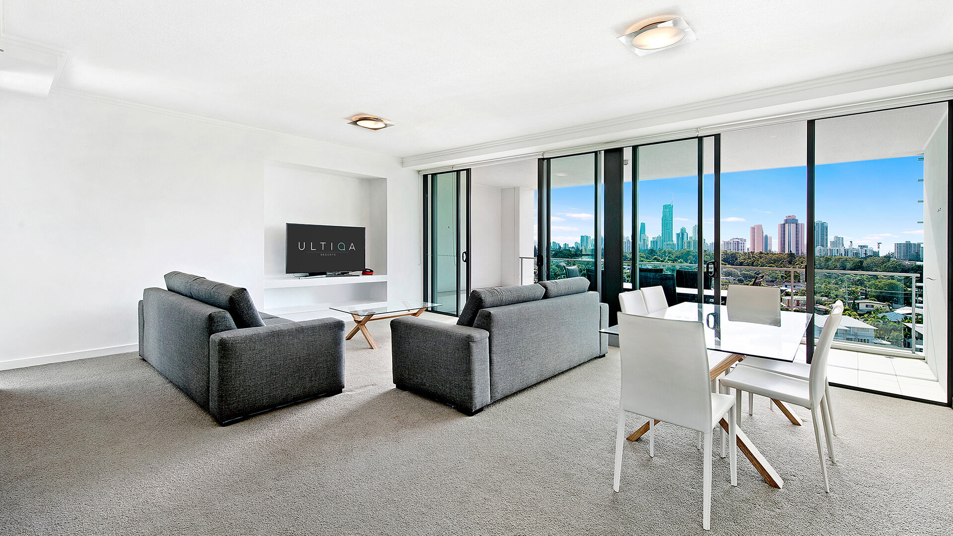 Spacious living and dining area with skyline views in the 3 Bedroom Apartment  at ULTIQA Freshwater Point Resort.