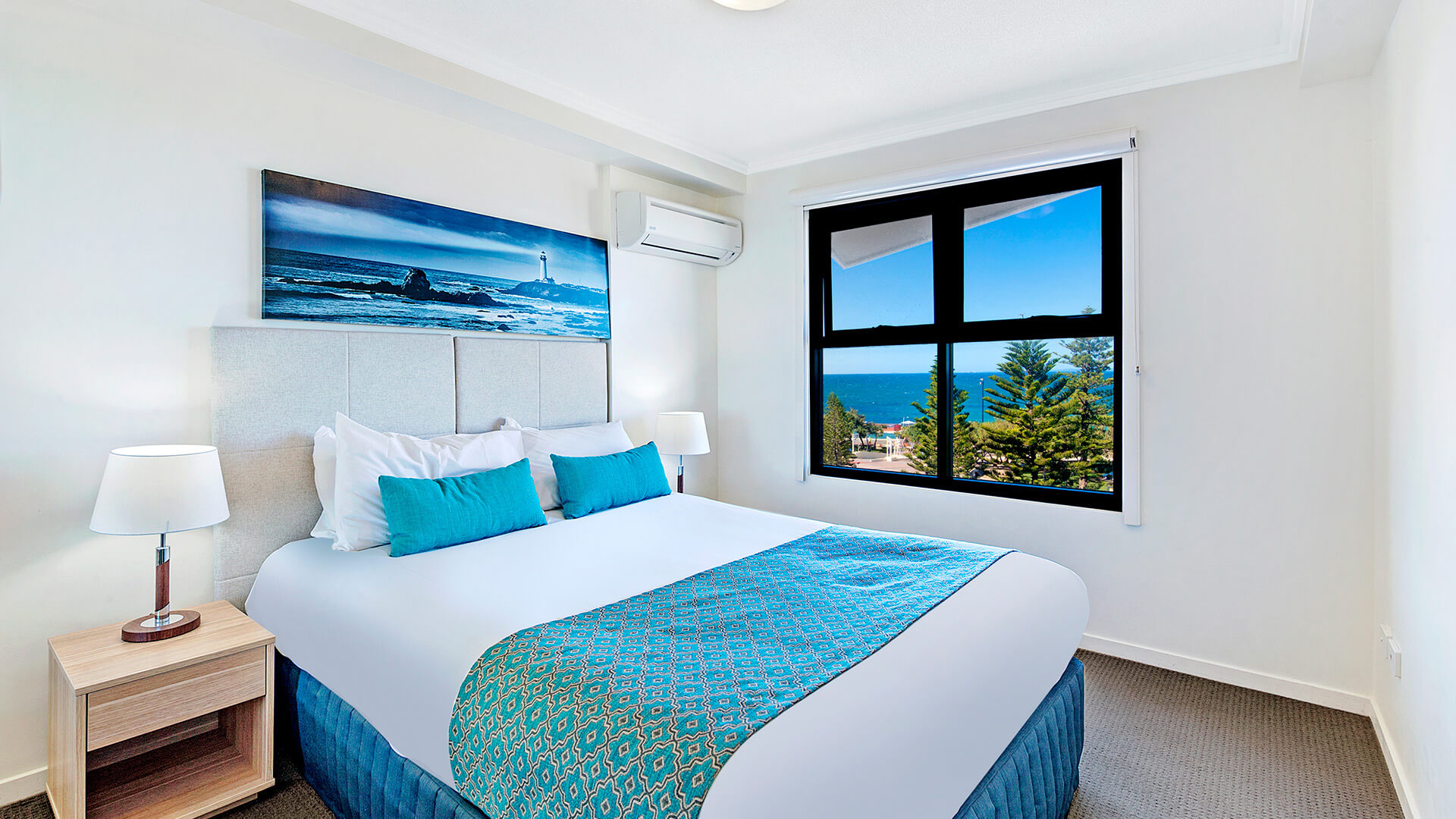 Bedroom with king bed and ocean views in 1 Bedroom Apartment at ULTIQA Shearwater Resort.